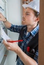 Young electrician working on electric panel Royalty Free Stock Photo