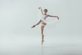 young elegant ballerina dancing in studio
