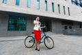 Young elegant business woman with bicycle and car Royalty Free Stock Photo