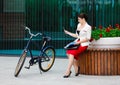 Young elegant business woman with bicycle Royalty Free Stock Photo