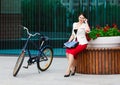 Young elegant business woman with bicycle Royalty Free Stock Photo