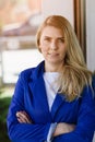 Young elegant business woman in blue jacket. Royalty Free Stock Photo