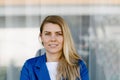 Young elegant business woman in blue jacket. Royalty Free Stock Photo