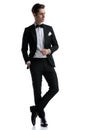Young elegant groom in tuxedo looking to side Royalty Free Stock Photo