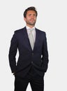 Young elegant and handsome businessman in suit and tie posing for company corporate portrait relaxed and confident isolated on wh Royalty Free Stock Photo