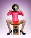 Young elegant lady with a vinyl disc