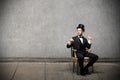 Young elegant man sitting on a chair Royalty Free Stock Photo