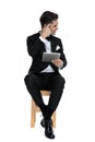 Young elegant man in tuxedo holding tab Royalty Free Stock Photo