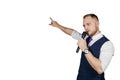 Young elegant talking man holding microphone talking with pointing finger. Isolated on white background. Showman concept Royalty Free Stock Photo