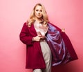 Young elegant woman in trendy red coat. Isolated studio shot Royalty Free Stock Photo