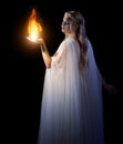 Young elven girl holding fire in palms Royalty Free Stock Photo