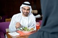 Young Emirati arab couple dining