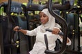 Young Emirati arab women wroking out in a Gym