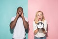 The young emotional angry woman screaming on pink studio background Royalty Free Stock Photo