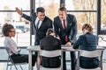 Young emotional businesspeople in formalwear arguing at meeting in office Royalty Free Stock Photo