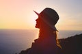 Young emotional woman enjoying sunset on cliff Royalty Free Stock Photo