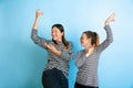 Young emotional women on gradient blue background