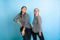 Young emotional women on gradient blue background Royalty Free Stock Photo