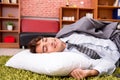The young employee sleeping on the floor at office Royalty Free Stock Photo