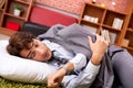 The young employee sleeping on the floor at office Royalty Free Stock Photo