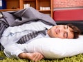 Young employee sleeping on the floor at office Royalty Free Stock Photo