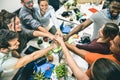 Young employee startup workers group stacking hands at start up office