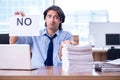 Young employee unhappy with excessive work Royalty Free Stock Photo