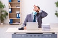 Young male employee wearing mask during pandemic Royalty Free Stock Photo
