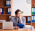 Young employee working in the office Royalty Free Stock Photo