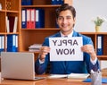 Young employee working in the office Royalty Free Stock Photo