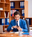 Young employee working in the office Royalty Free Stock Photo