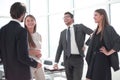 Employees discuss something standing in the office Royalty Free Stock Photo