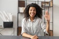 African-American woman saying hey on an interview