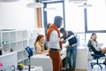 Young energetic office worker in casual outfit reading important paper Royalty Free Stock Photo