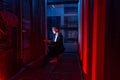 Female system manager configuring servers in server room Royalty Free Stock Photo