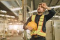 young engineer male caucasian worker tired exhausted fatigue from hard working in heavy industry machinery factory Royalty Free Stock Photo