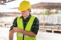 Young engineer man man are roll up the sleeves at a construction site Royalty Free Stock Photo