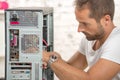 Young engineer repaired a computer Royalty Free Stock Photo