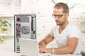 Young engineer repaired a computer Royalty Free Stock Photo