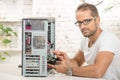 Young engineer repaired a computer Royalty Free Stock Photo
