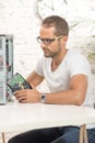 Young engineer repaired a computer Royalty Free Stock Photo