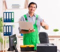Young engineer repairing broken computer at the office Royalty Free Stock Photo