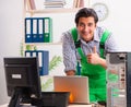 Young engineer repairing broken computer at the office Royalty Free Stock Photo