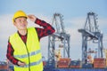 Engineer with safety helmet with industrial port containers background Royalty Free Stock Photo