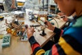 There is no impossible. Cropped shot of young engineer using soldering iron to join chips and wires. Robotics and Royalty Free Stock Photo