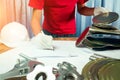 Young engineer working hard to checking a food canned used before recycle fused to create new materials in iron industry.