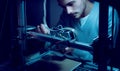 Young engineer working on a 3D printer Royalty Free Stock Photo