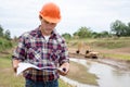 Young engineer working on site at the dam Royalty Free Stock Photo