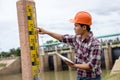 Young engineer working on site at the dam Royalty Free Stock Photo