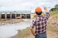Young engineer working on site at the dam Royalty Free Stock Photo